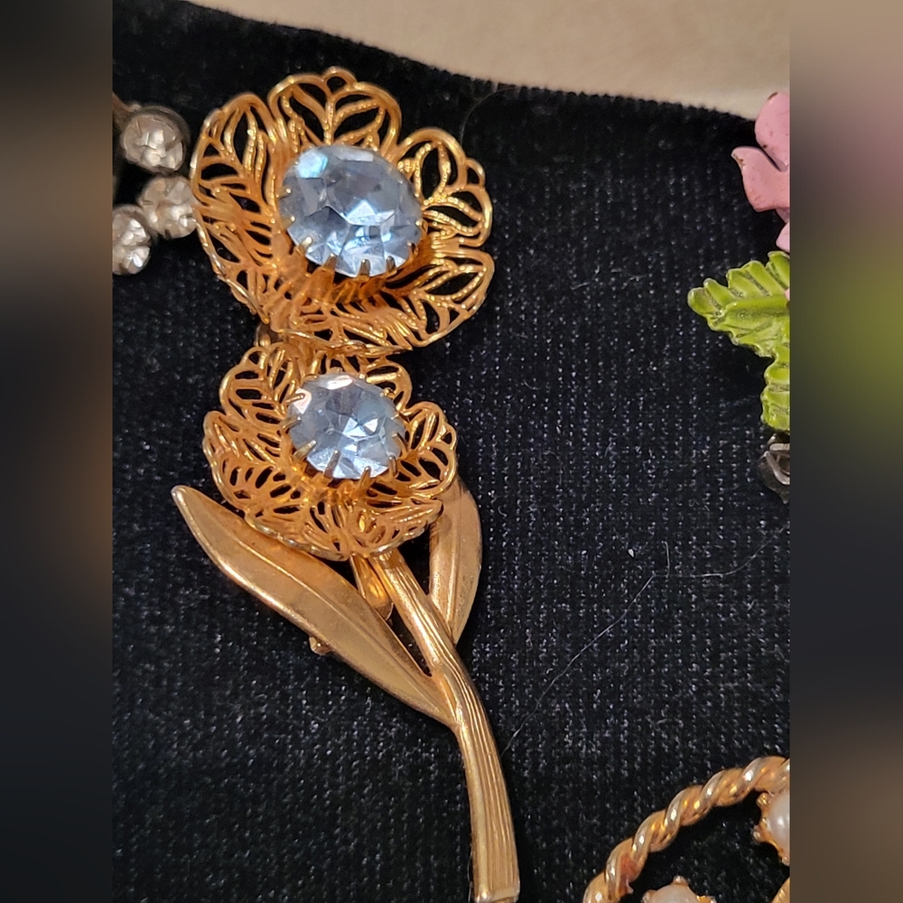Gold tone floral blue rhinestone brooch Vintage